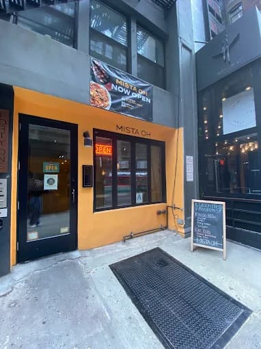 Mista Oh — Holly's family restaurant in Manhattan, with a hand-taped paper sign in the window